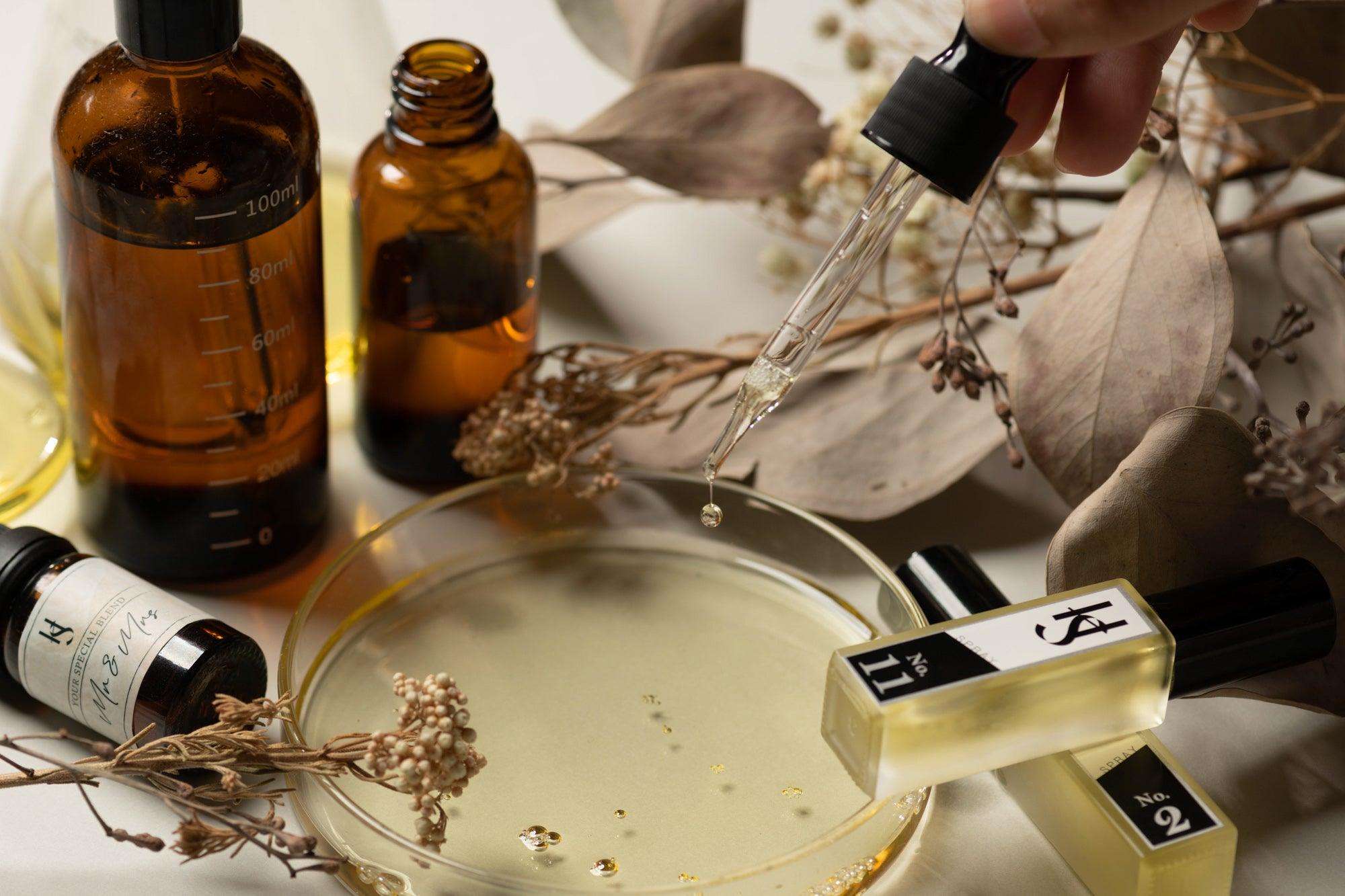 Essential Oil places on a glass plate with essential oil bottles.